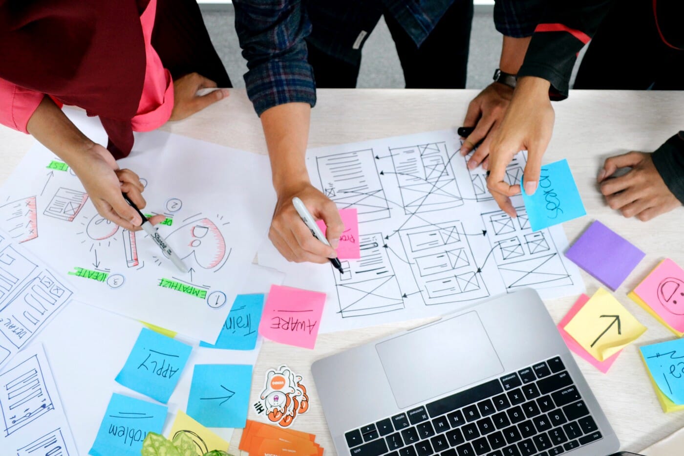 a group of designers wireframing during a meeting